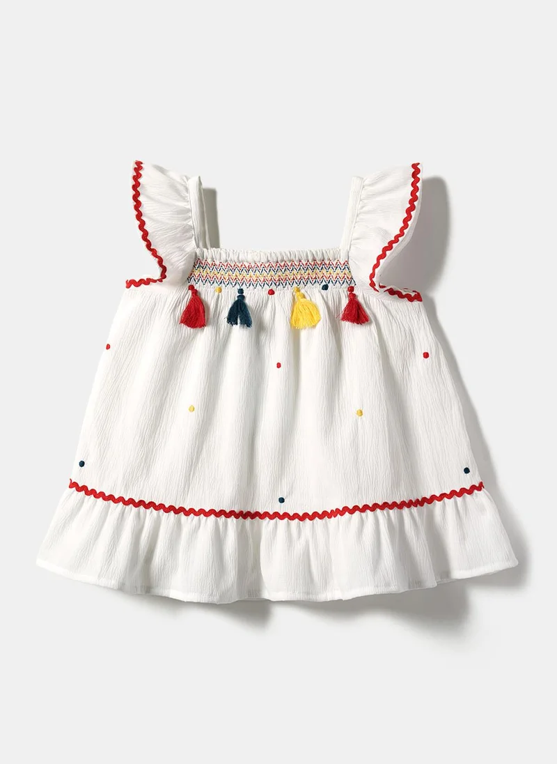 Nautinati  Girls' A-line Polka Dot Embroidered Dress with Multicolour Tassels & Smocked Neck for Women | Best Price UAE